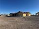 Rear view of the house, showcasing a covered patio area at 3720 W Charleston Park Ave, Pahrump, NV 89048