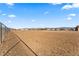 View of a property with a chain-link fence marking the boundary at 3720 W Charleston Park Ave, Pahrump, NV 89048