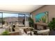 Living room with access to a balcony and mountain views at 3979 Heron Fairway Dr, Las Vegas, NV 89141