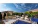 Stunning pool with lounge chairs and mountain views at 4086 Heron Fairway Dr, Las Vegas, NV 89141