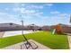 Spacious backyard with turf, playset, and basketball court at 4509 Glossier Ave, North Las Vegas, NV 89084