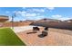 Backyard with firepit, basketball court and playset at 4509 Glossier Ave, North Las Vegas, NV 89084