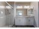 Bathroom with double vanity and walk-in shower at 4509 Glossier Ave, North Las Vegas, NV 89084