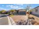 Single story house with a two-car garage and brick paver driveway at 4509 Glossier Ave, North Las Vegas, NV 89084