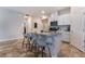 Modern kitchen with white cabinets, granite island and stainless steel appliances at 4509 Glossier Ave, North Las Vegas, NV 89084