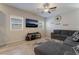 Spacious living room with L-shaped sectional sofa and large TV at 4509 Glossier Ave, North Las Vegas, NV 89084