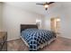 Spacious main bedroom with carpeted floor and ceiling fan at 4509 Glossier Ave, North Las Vegas, NV 89084