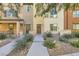 Attractive townhome exterior with landscaped walkway at 4650 Ranch House Rd # 42, North Las Vegas, NV 89031