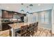 Kitchen featuring an island with barstool seating, granite counters, and modern appliances at 4650 Ranch House Rd # 42, North Las Vegas, NV 89031