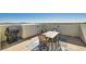 Private rooftop patio with seating area and grill at 4650 Ranch House Rd # 42, North Las Vegas, NV 89031