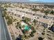 Aerial view of community with pool and surrounding buildings at 4921 Black Bear Rd # 104, Las Vegas, NV 89149