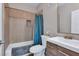 Updated bathroom with tub shower combo and wood vanity at 4921 Black Bear Rd # 104, Las Vegas, NV 89149