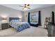 Bright bedroom with a queen-size bed and window seating at 4921 Black Bear Rd # 104, Las Vegas, NV 89149