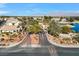 Community entrance with gated access and landscaping at 4921 Black Bear Rd # 104, Las Vegas, NV 89149