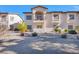 Two-story building with balcony and landscaping at 4921 Black Bear Rd # 104, Las Vegas, NV 89149