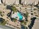 Aerial view of community pool and surrounding landscape at 4921 Black Bear Rd # 104, Las Vegas, NV 89149