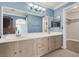 Double sink bathroom with light wood cabinets at 503 Fragrant Orchard St, Henderson, NV 89015