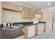 Kitchen with light wood cabinets, stainless steel sink, and appliances at 503 Fragrant Orchard St, Henderson, NV 89015