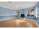 Living room with fireplace and light hardwood floors at 503 Fragrant Orchard St, Henderson, NV 89015