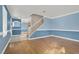 Hardwood floor living room with blue walls and staircase at 503 Fragrant Orchard St, Henderson, NV 89015