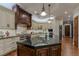 Gourmet kitchen with large island and dark wood cabinetry at 52 Innisbrook Ave, Las Vegas, NV 89113