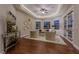 Elegant sitting room with hardwood floors, cozy seating, and French doors at 52 Innisbrook Ave, Las Vegas, NV 89113