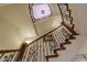 Ornate wooden staircase with wrought-iron railings at 52 Innisbrook Ave, Las Vegas, NV 89113