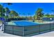 Tennis courts with blue surface and chain link fence at 52 Innisbrook Ave, Las Vegas, NV 89113