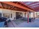 Covered patio with seating area, grill, and access to interior at 5242 Dickens Dr, Las Vegas, NV 89119