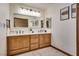 Modern bathroom with double vanity and wood cabinets at 5242 Dickens Dr, Las Vegas, NV 89119