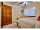 Well-lit bedroom with wood floors and window blinds at 5242 Dickens Dr, Las Vegas, NV 89119