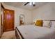 Large bedroom with a full-size bed and mirror at 5242 Dickens Dr, Las Vegas, NV 89119