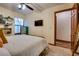 Spacious bedroom with a TV and hardwood floors at 5242 Dickens Dr, Las Vegas, NV 89119