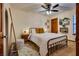 Bedroom featuring metal bed frame and wood floors at 5242 Dickens Dr, Las Vegas, NV 89119