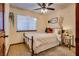 Cozy bedroom with metal bed frame and window blinds at 5242 Dickens Dr, Las Vegas, NV 89119