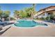 Inviting community pool with lounge chairs and a clear blue at 5242 Dickens Dr, Las Vegas, NV 89119