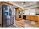 Kitchen features stainless steel appliances and wood cabinets at 5242 Dickens Dr, Las Vegas, NV 89119