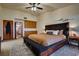 Main bedroom with king bed, en-suite bathroom access, and ample closet space at 5242 Dickens Dr, Las Vegas, NV 89119