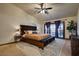 Spacious main bedroom with king-size bed and access to patio at 5242 Dickens Dr, Las Vegas, NV 89119