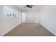 Bright bedroom featuring grey carpet, ceiling fan and window with blinds at 5264 Lookout St, Las Vegas, NV 89120