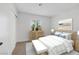 Bedroom with light walls, queen bed, and wood dresser at 5264 Lookout St, Las Vegas, NV 89120