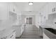 Modern kitchen with white cabinets and quartz counters at 5264 Lookout St, Las Vegas, NV 89120