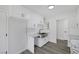 White shaker cabinets and a farmhouse sink at 5264 Lookout St, Las Vegas, NV 89120