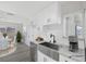 Modern kitchen with white cabinets and a farmhouse sink at 5264 Lookout St, Las Vegas, NV 89120