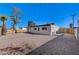 Spacious backyard with gravel and a view of the home at 6252 Fairwood Ave, Las Vegas, NV 89107