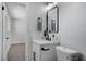 Modern bathroom with a white vanity and black accents at 6252 Fairwood Ave, Las Vegas, NV 89107