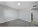 Bright bedroom with grey carpet and access to a bathroom at 6252 Fairwood Ave, Las Vegas, NV 89107