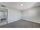 Bright bedroom with grey carpet and access to another bedroom at 6252 Fairwood Ave, Las Vegas, NV 89107