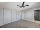 Well-lit bedroom, featuring grey carpet and built-in closet at 6252 Fairwood Ave, Las Vegas, NV 89107