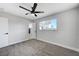 Bright bedroom featuring ceiling fan and grey carpet at 6252 Fairwood Ave, Las Vegas, NV 89107